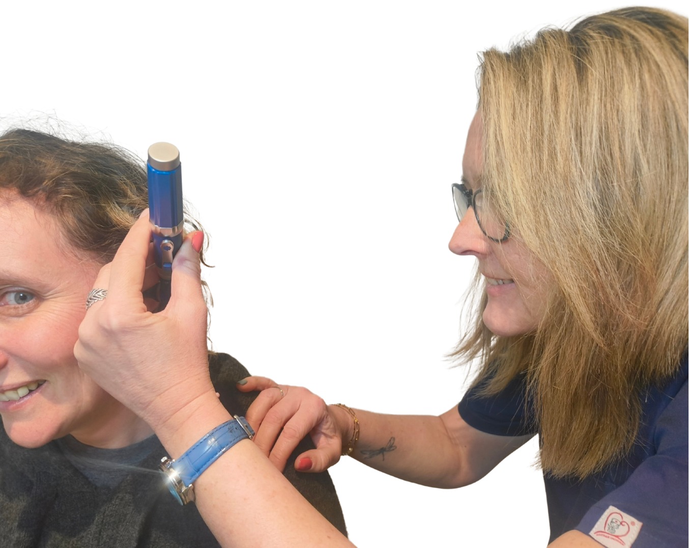 Image shows earwax professional removing earwax from a patient's ear